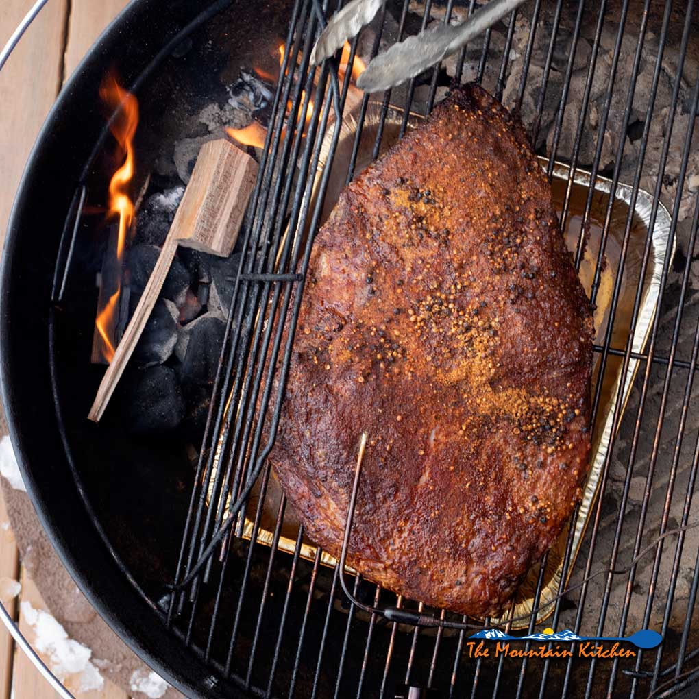 pastrami smoking on grill
