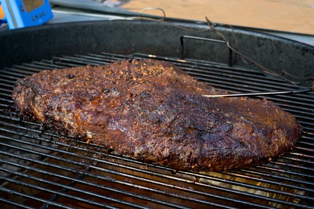 pastrami smoking on grill