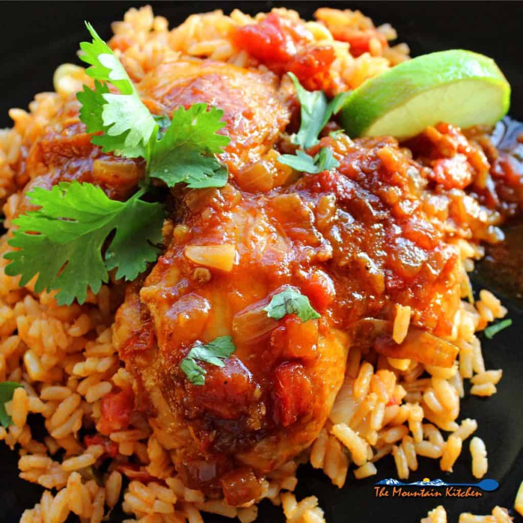 Mexican deviled chicken served on plate with rice