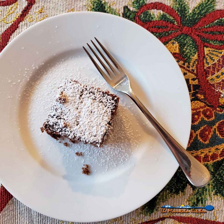 gingerbread cake on plate with fork and holiday placemat