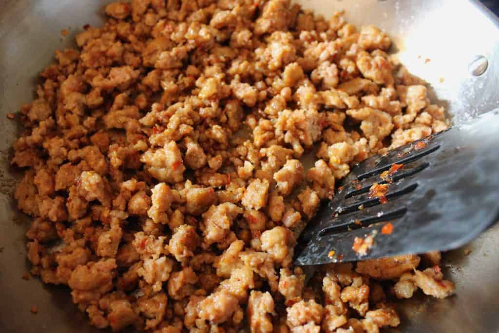 Hot Italian sausage is the star ingredient of this sausage ragu which lends rich layers of flavor simmered with mild tomatoes and seasoned vegetables.