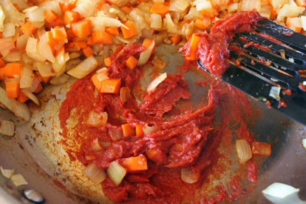 browning tomato paste in pan