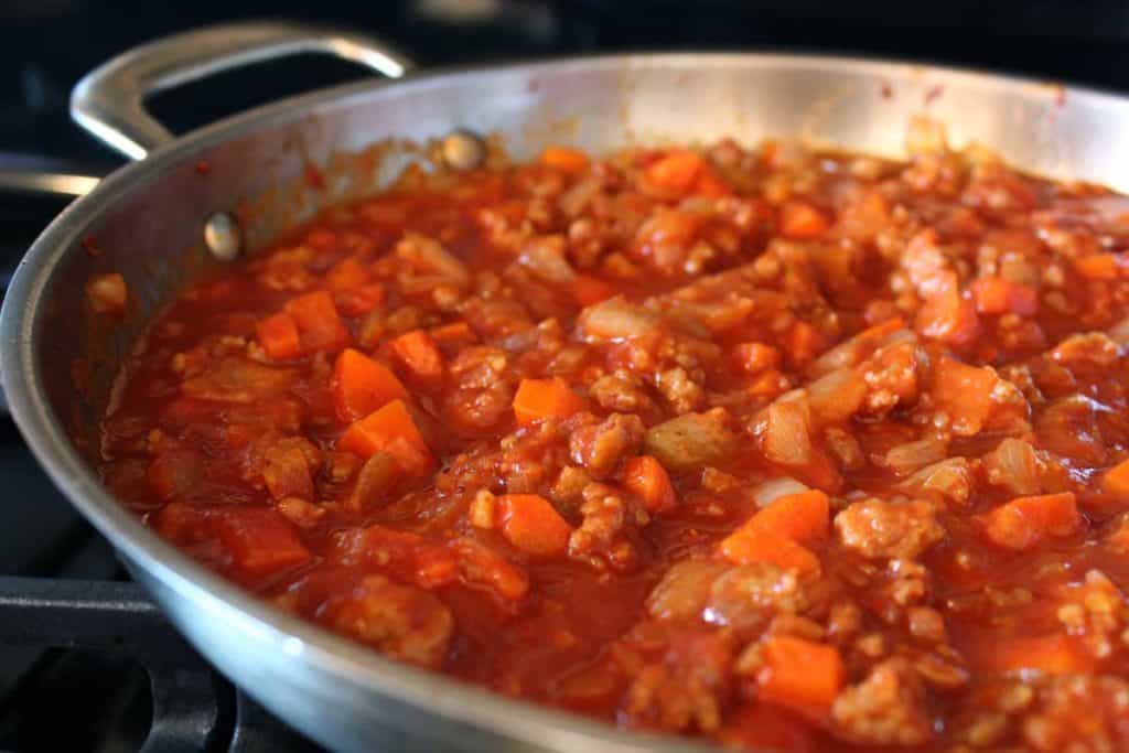 ragu simmering on stovetop