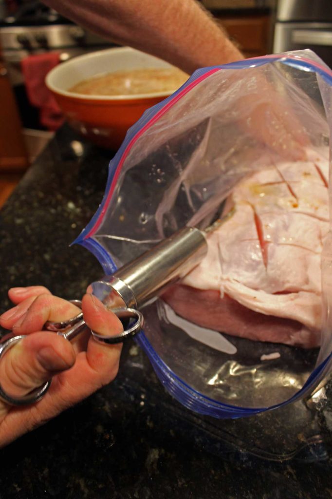 injecting the pork loin with brine