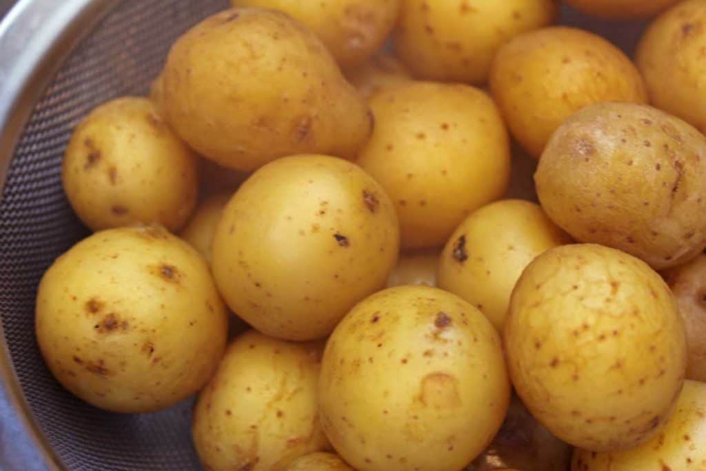 Hot potatoes in a strainer.