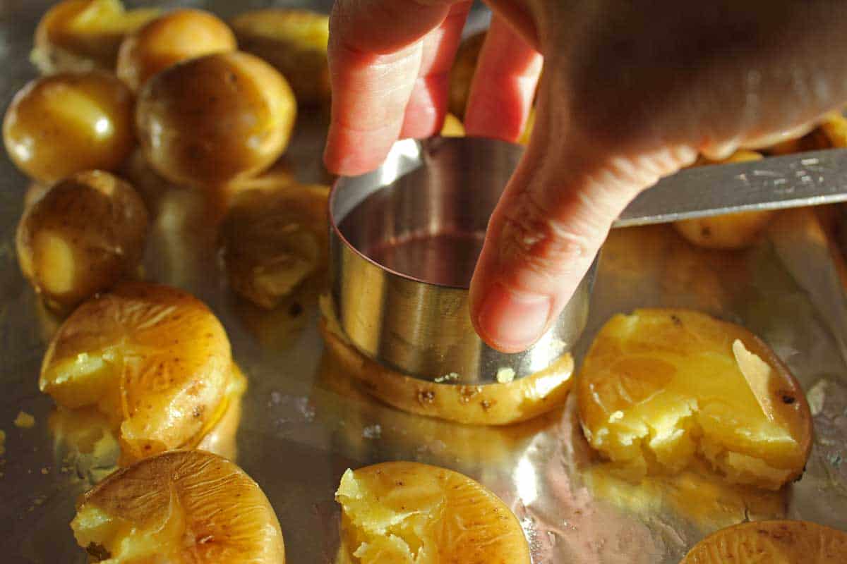 Smashing a potato on a sheet pan.