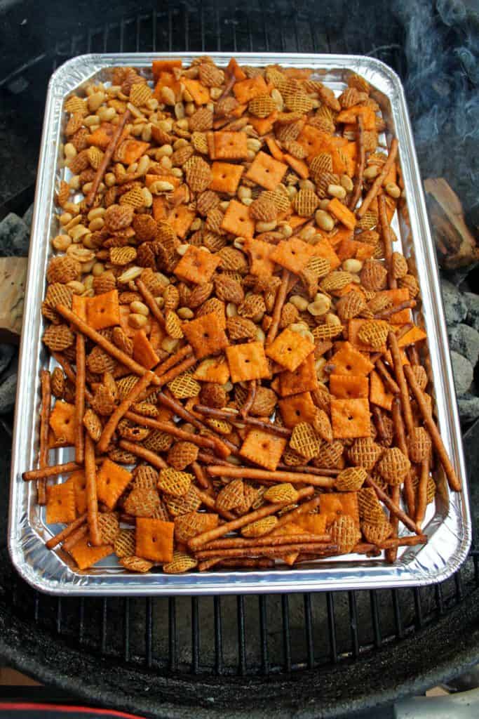 pan of snack mix on the grill