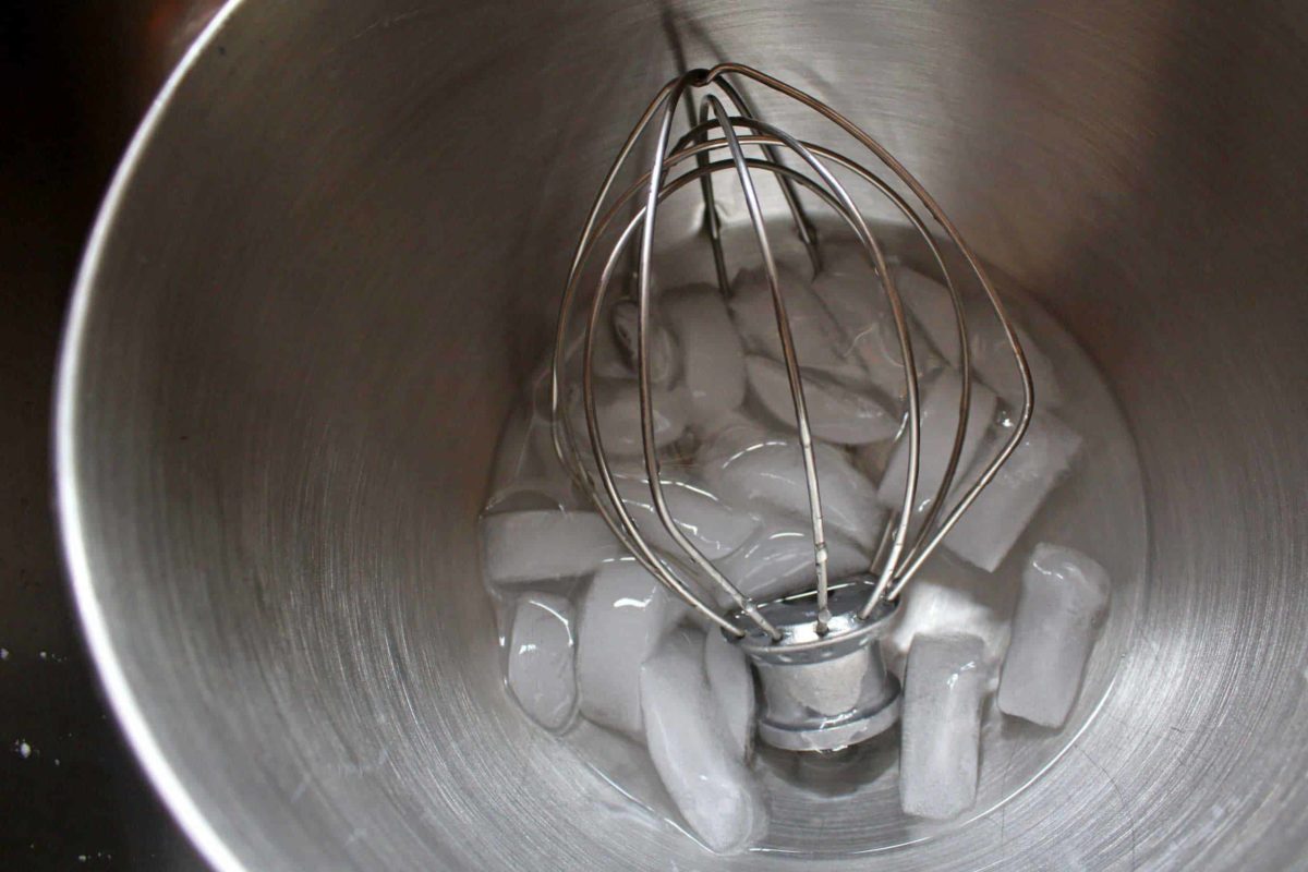 stainless steal bowl of ice water with a whisk