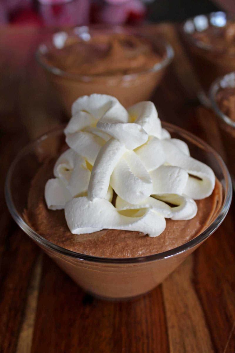 whipped cream piped on top of the mousse
