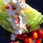 This delicious classic wedge salad has crisp iceberg lettuce wedges topped with creamy homemade blue cheese dressing, smoky bacon, and juicy tomatoes.
