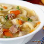 Tortellini in Brodo is made of soft pillowy cheese tortellinin in a rich flavorful broth of vegetables, smoked ham, parmesan cheese rind, and lemon zest.