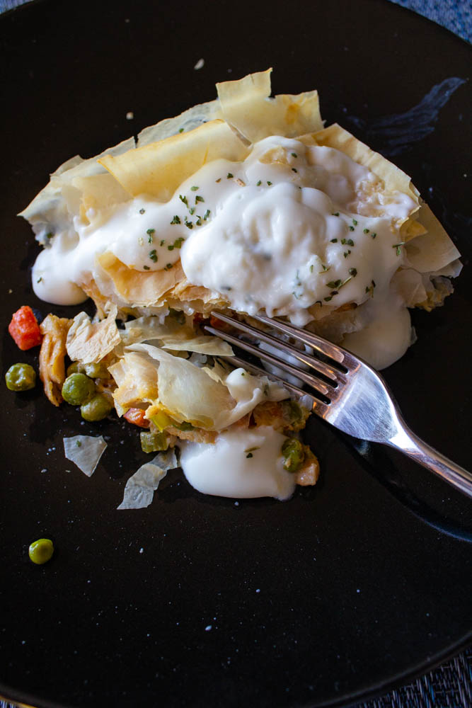 Healthy chicken pot pie loaded with juicy chicken and fresh vegetables, topped with a golden brown phyllo dough crust. Low-calorie, so enjoy guilt-free!