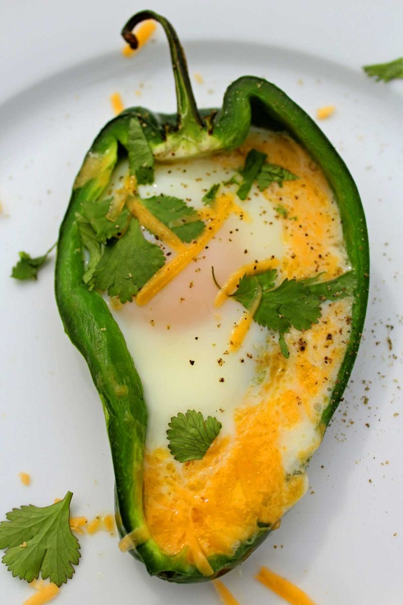 Egg stuffed poblano pepper boats are a low-carb twist to the classic egg in a basket. A great vegetarian option to serve for any Meatless Monday meal.