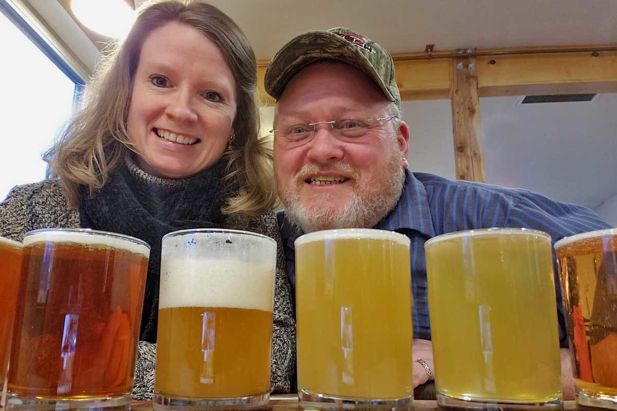 Debbie and David having a flight of beer