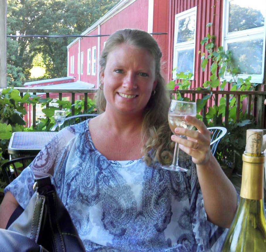 Debbie Spivey with glass of wine