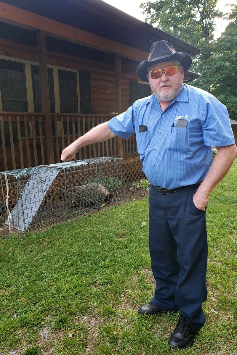 David holding trapped groundhog