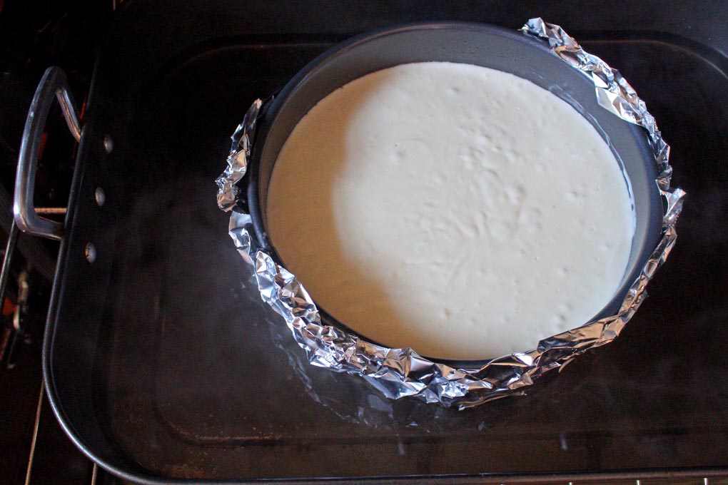 cheesecake inside a springform pan with water bath