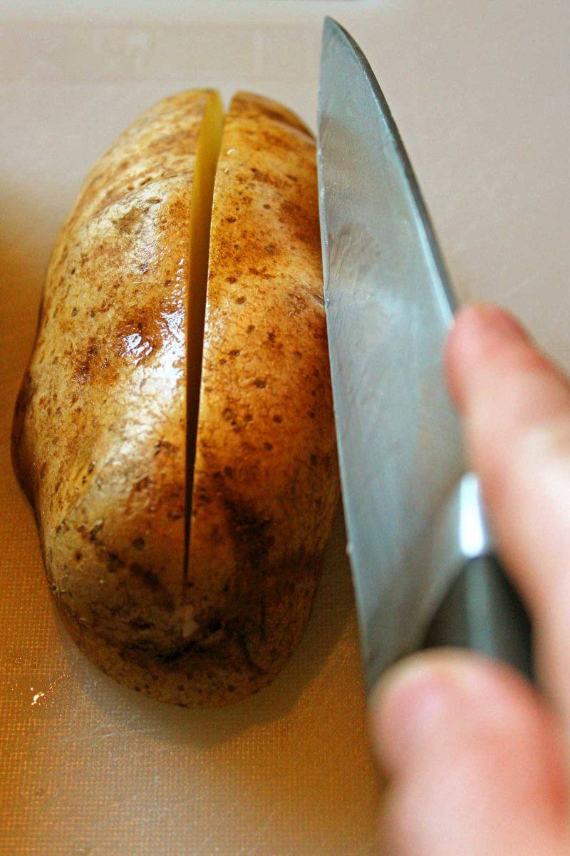 cutting potato with knife