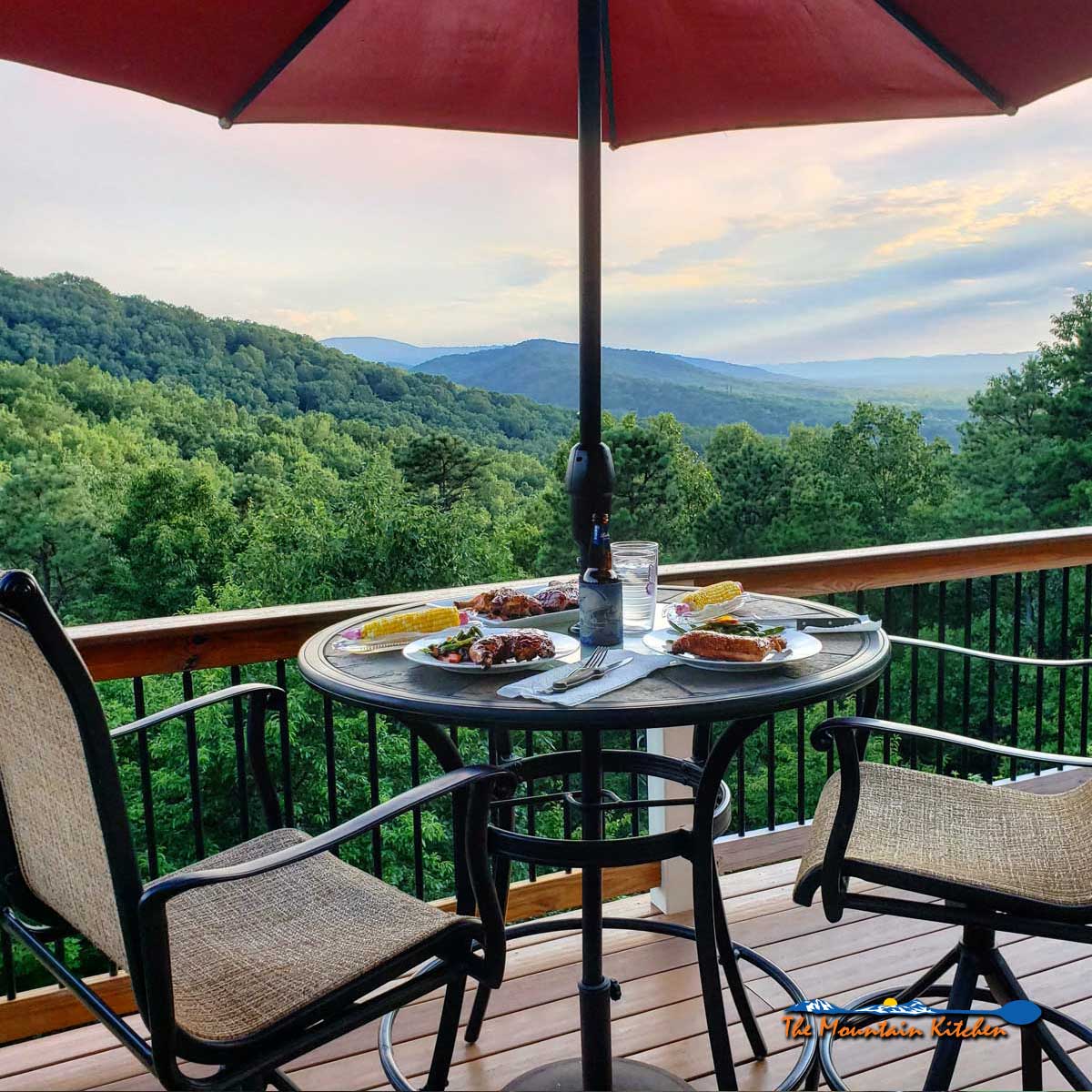 umbrella table with dinner and mountain view