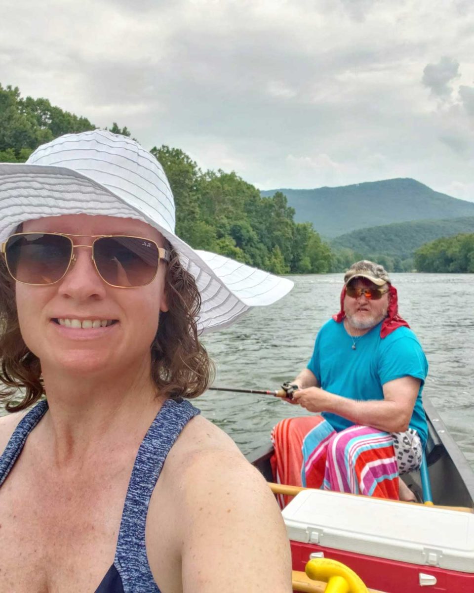 Debbie and David on canoe in river