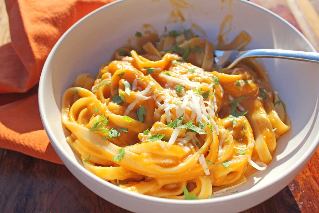 butternut squash fettuccine served in pasta bowl with spoon