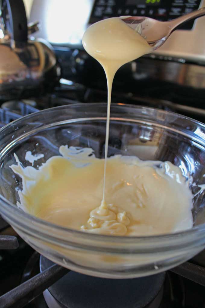 drizzling spoon of white chocolate