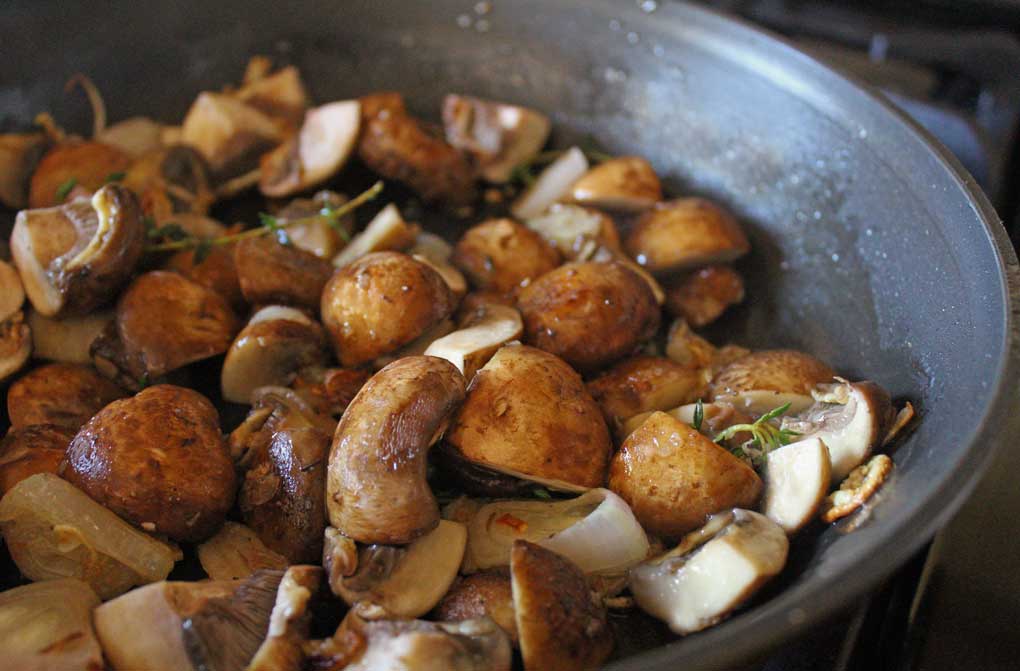 mushrooms cooking in skilllet