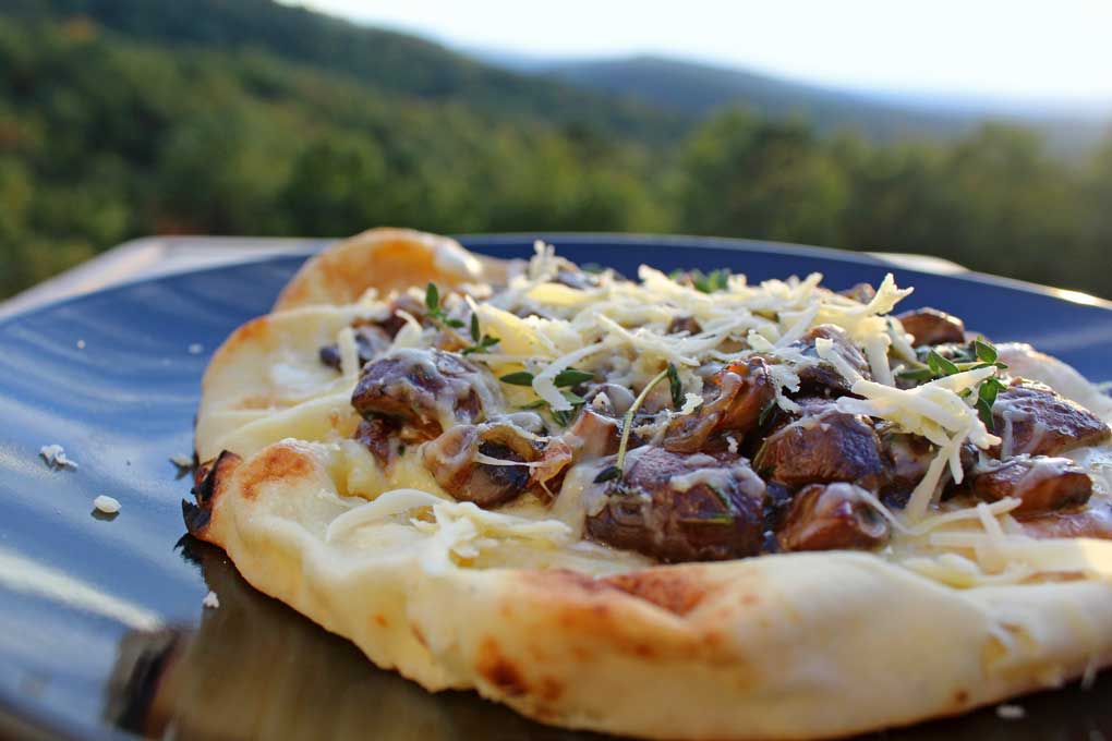 mushroom flatbread pizza with mountain view