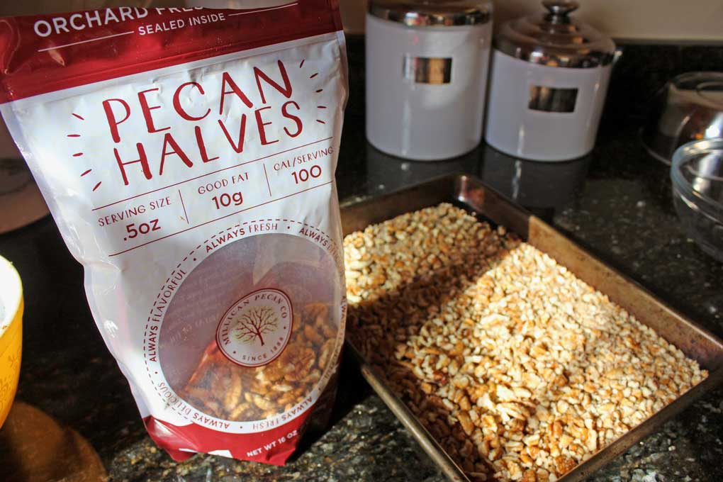 Millican Pecan Halves chopped on sheet pan