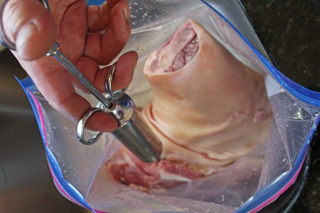 injecting pork with brine inside zip-top bag
