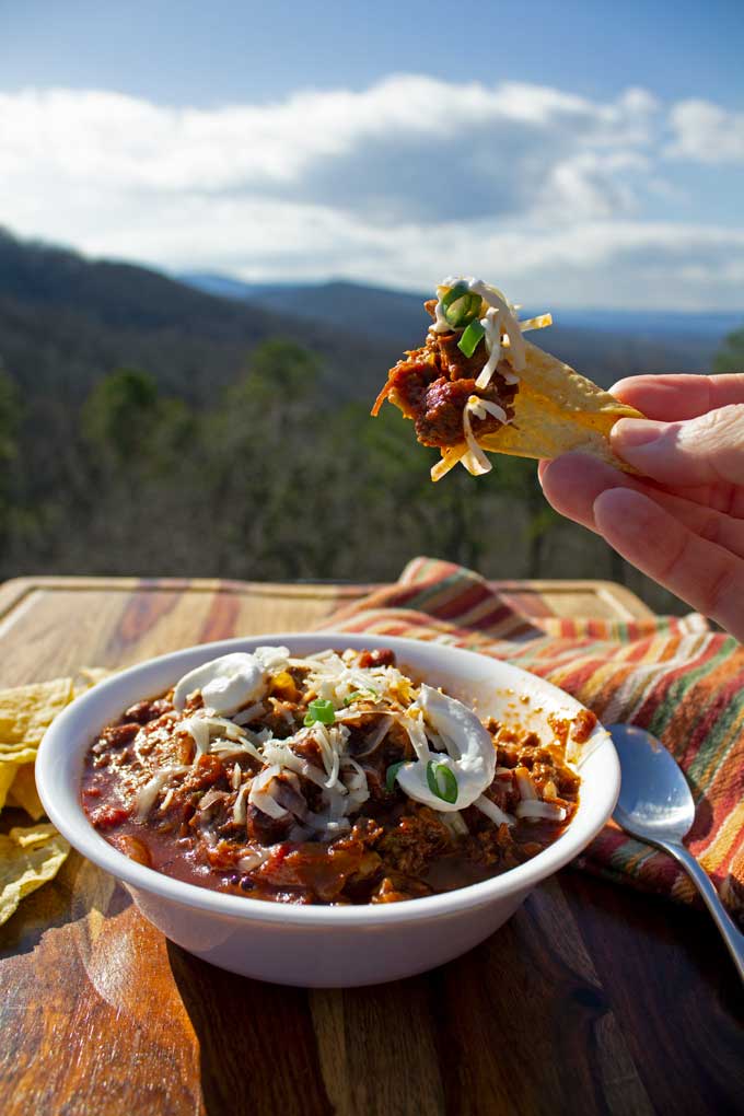chili on tortilla chip with mountain view