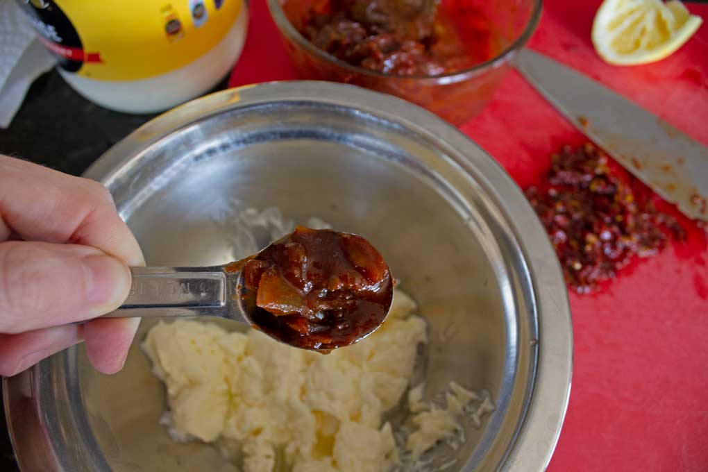 adding chipotle pepper to bowl