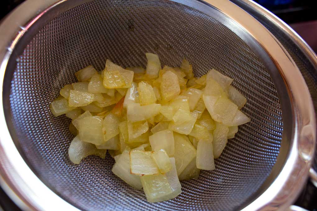 onions cooling in sieve