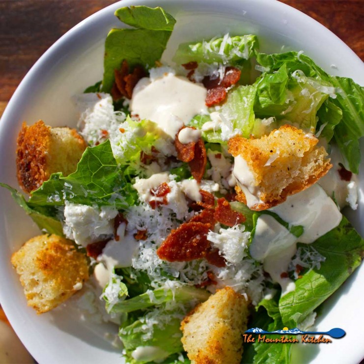 casesar salad with pepperoni bits and feta