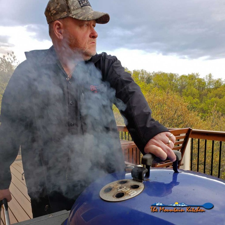David looking into the distance by the grill
