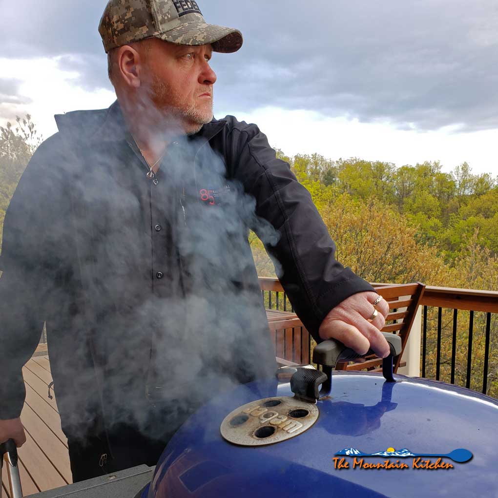 David looking into the distance by the grill