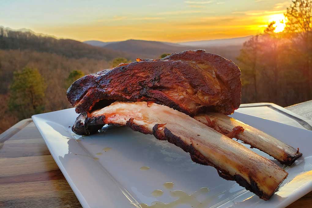 finished smoked beef short ribs with mountain sunset