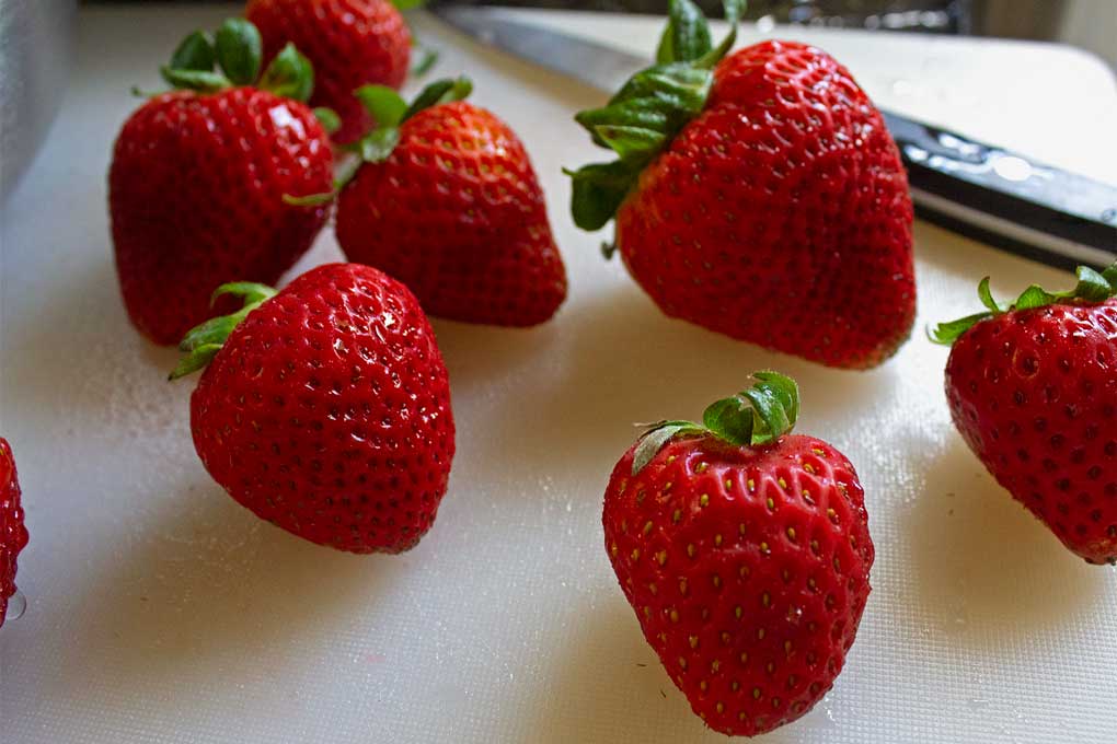 strawberries on cutting board