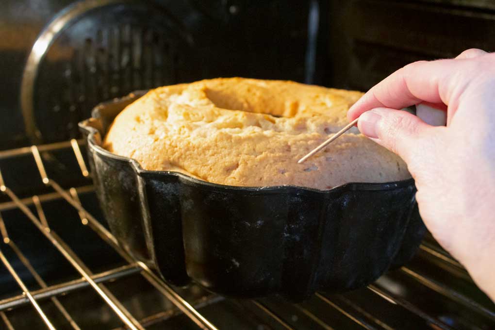 sticking toothpick into cake
