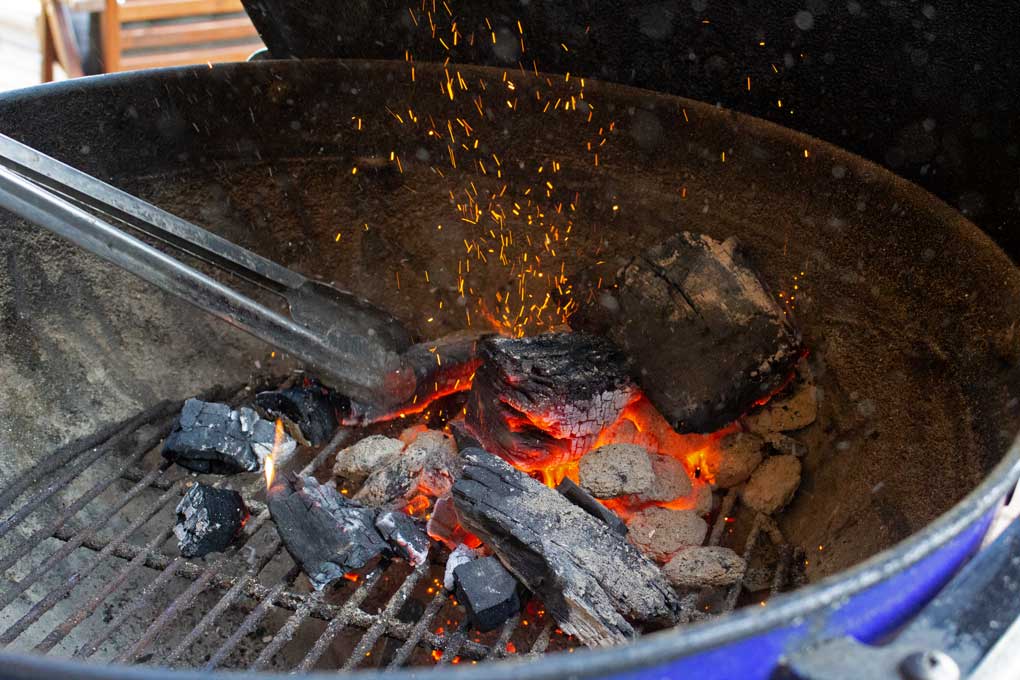 preparing hot coals for meat