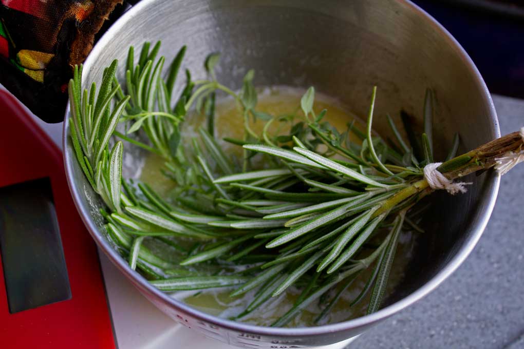 herb brush in melted garlic butter