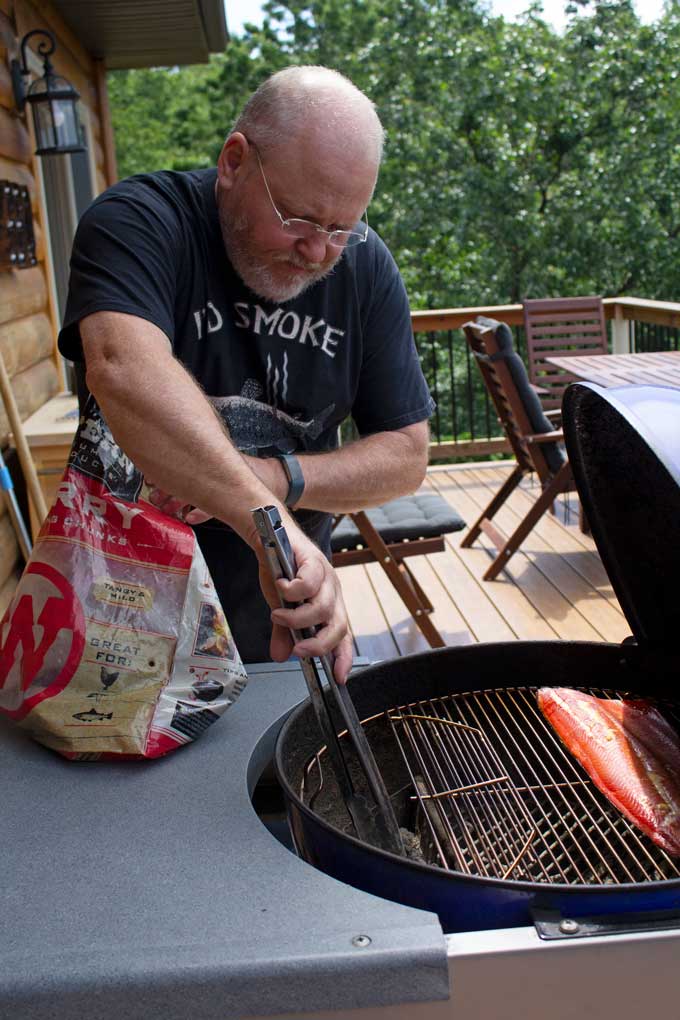 David tending to grill for honey smoked salmon