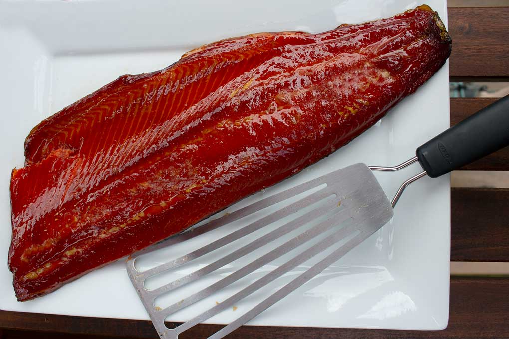 honey smoked salmon on platter with fish spatula