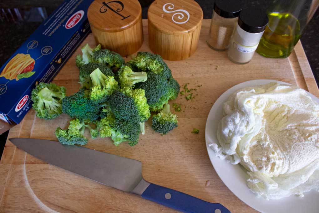 pasta, broccoli and ricotta on cutting board