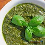 fresh pesto in a bowl with fresh basil leaves