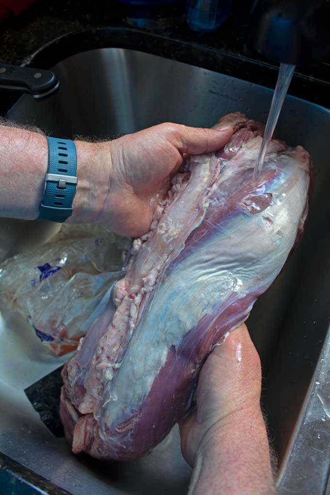 running tenderloin under cold running water