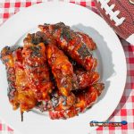 bacon-wrapped BBQ chicken tenders on plate