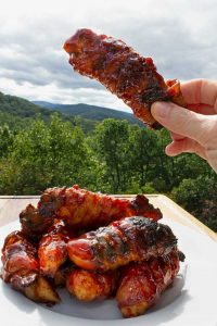bacon-wrapped bbq chicken tender with mountain view