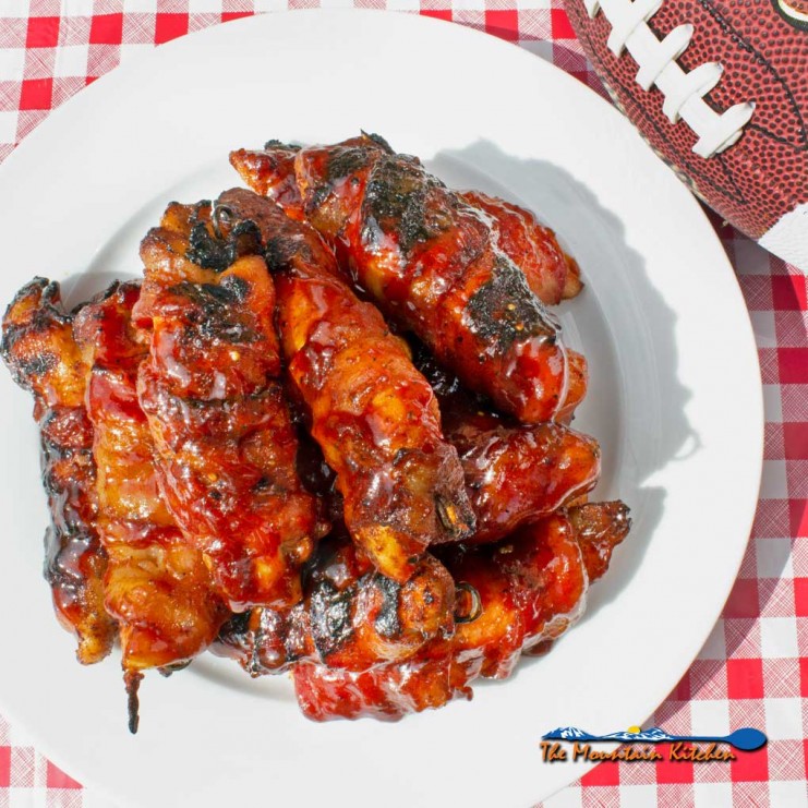 bacon-wrapped BBQ chicken tenders on plate