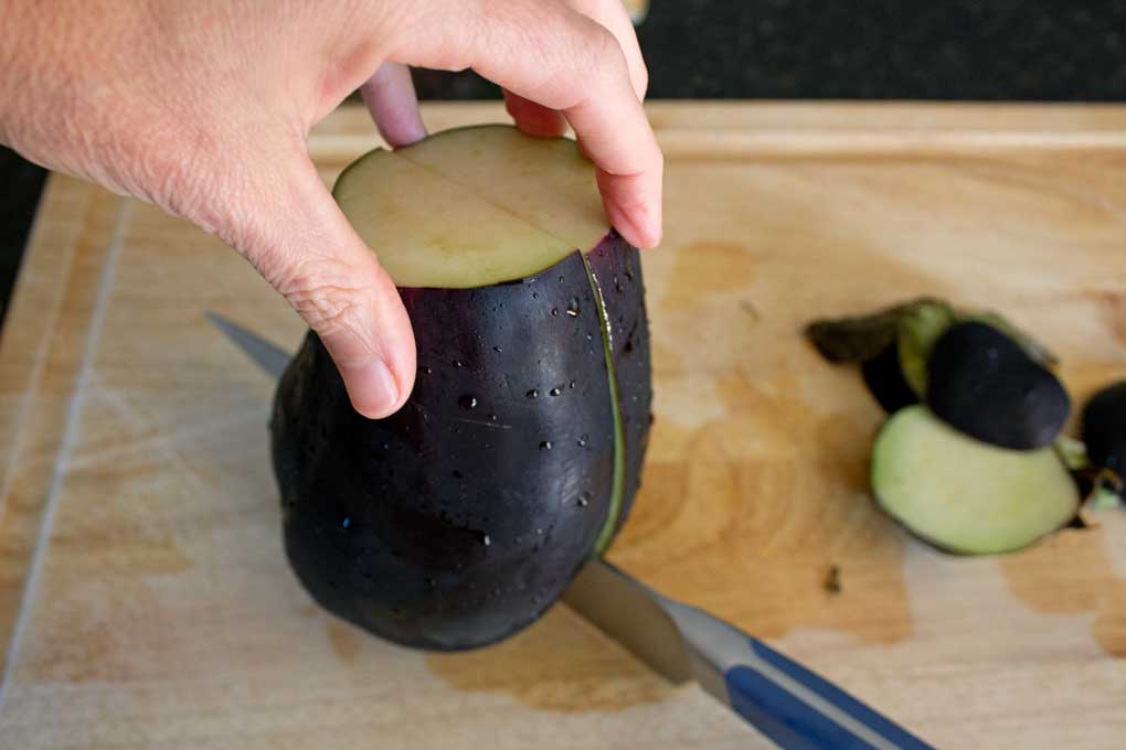 slicing eggplant with knife